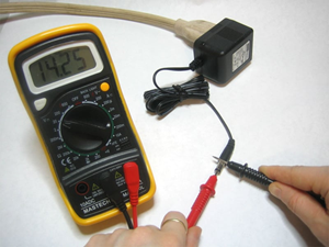 Testing a 12V Power Supply Output Using a Digital Multimeter
